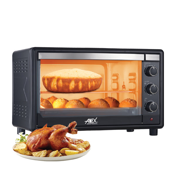 Anex Oven Toaster AG-3067EX with baked goods inside and a roasted chicken on a plate in front.