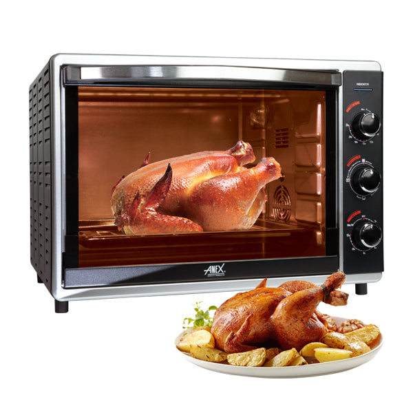 Anex_Oven_Toaster_AG-3070 with a roasted chicken inside, next to a plate of roasted chicken and potatoes.