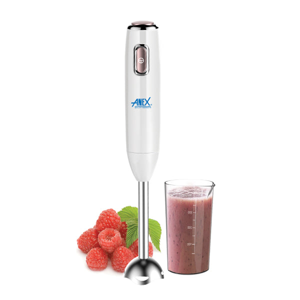 Hand blender with a glass of smoothie and raspberries on a white background