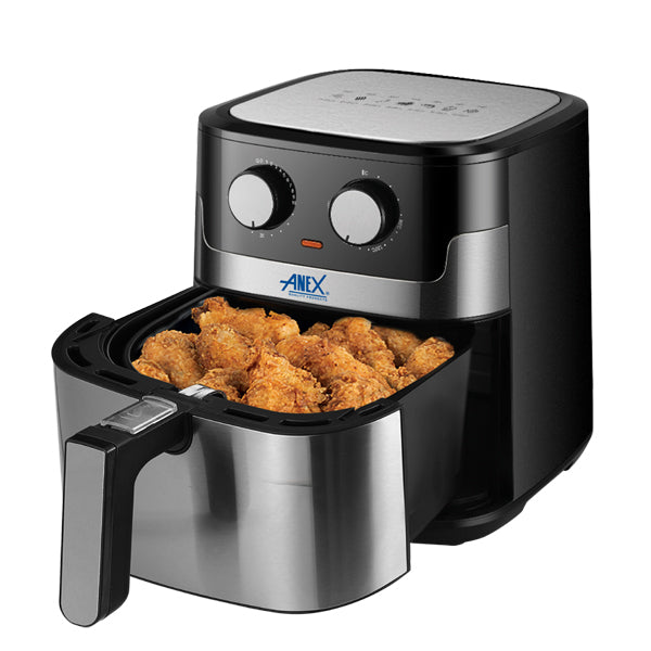 Black and silver air fryer with fried food inside