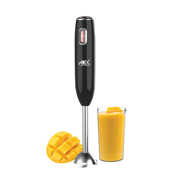 Black hand blender with a glass of orange juice and mango pieces on a white background