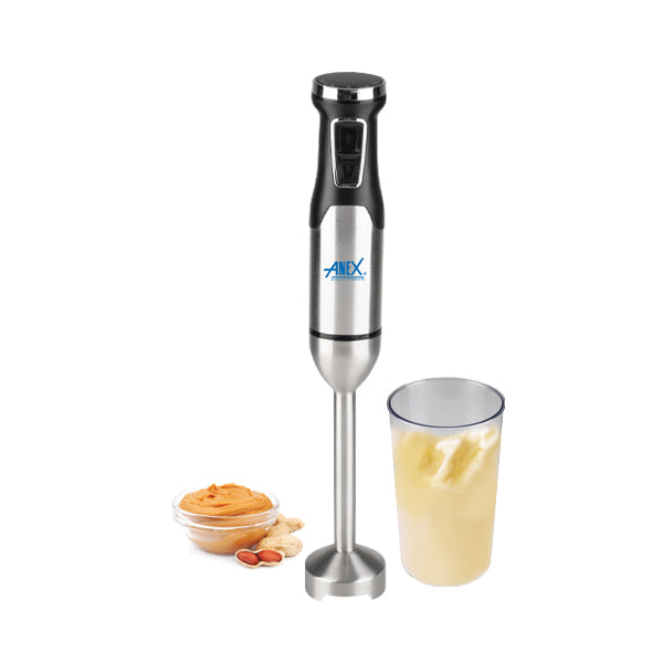 Stainless steel immersion blender with a glass container of blended mixture on a white background